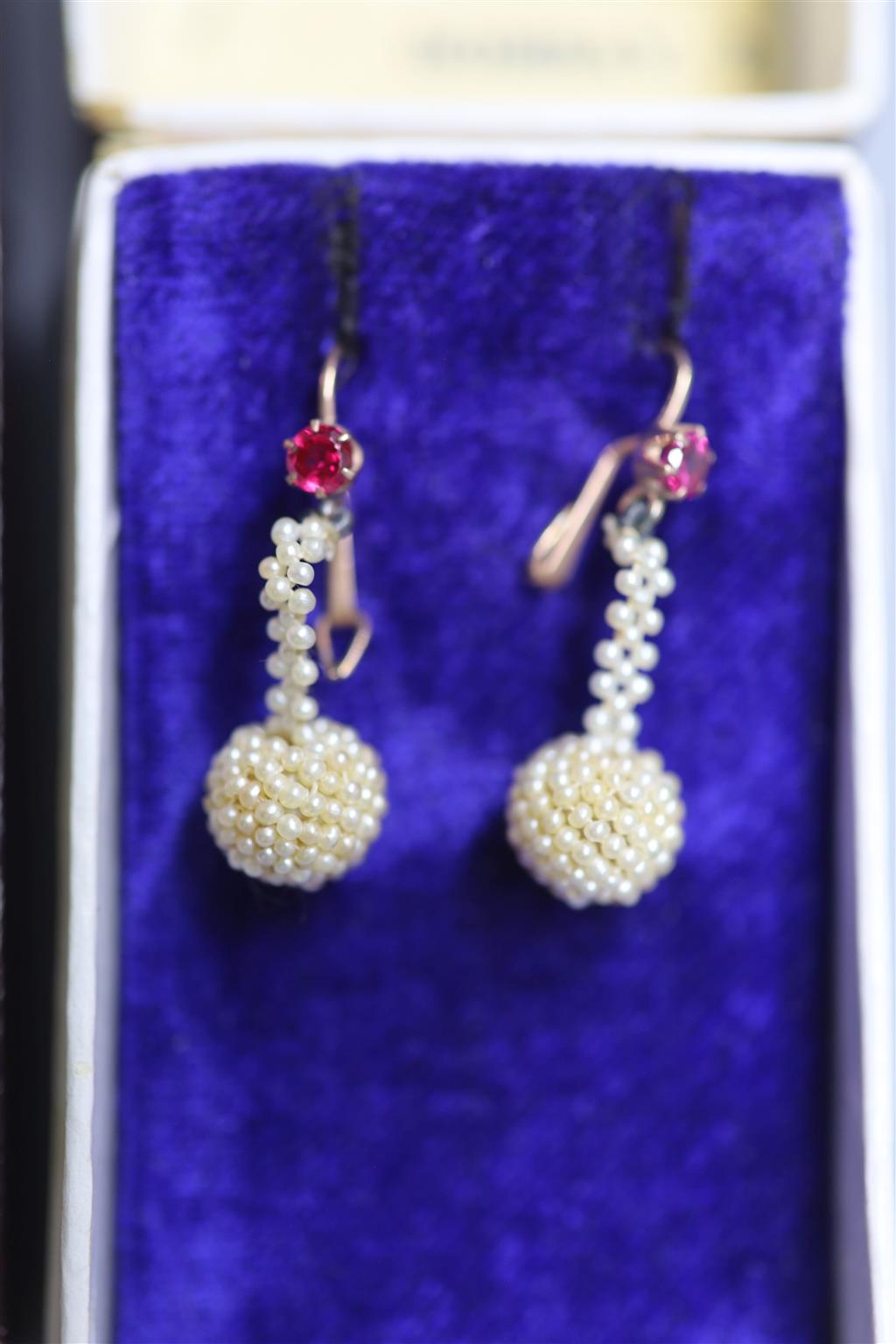 Two pairs of Indian yellow metal, seed pearl cluster and gem set drop earrings, largest 45mm, gross 5.5 grams.